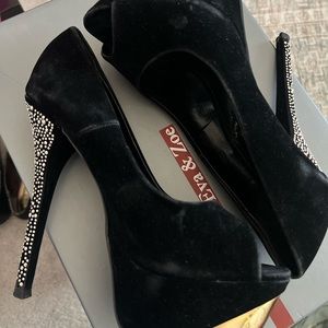 Black velvet peeptoe heels with gold accents